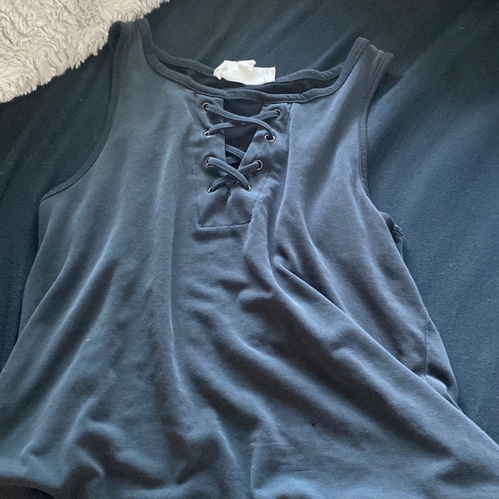 This is a tank top with kind of a cut out design at the top. it’s size XS.